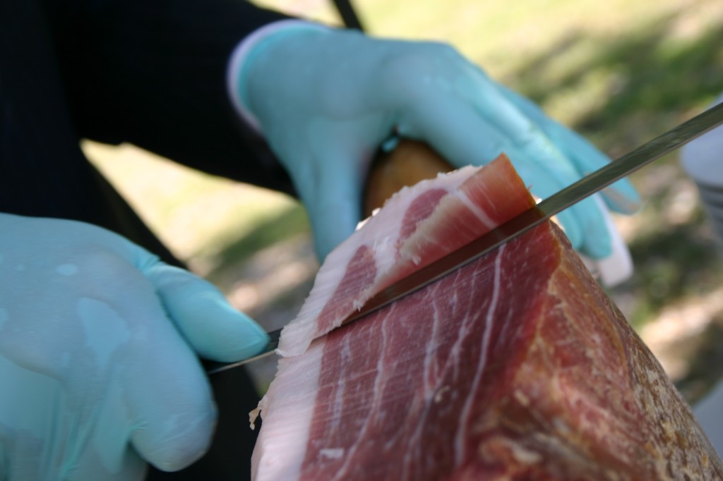 Prosciutto being hand-carved at the wedding